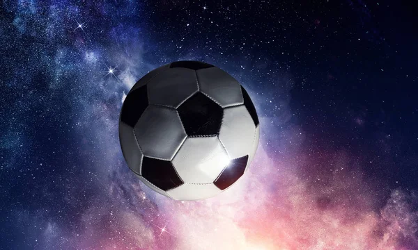 Bola de futebol no cosmos — Fotografia de Stock