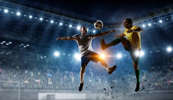 Soccer players at stadium. Mixed media — Stock Photo, Image