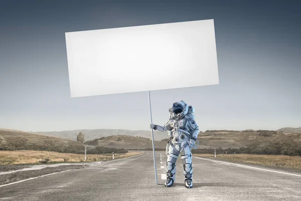 Spaceman with banner. Mixed media — Stock Photo, Image