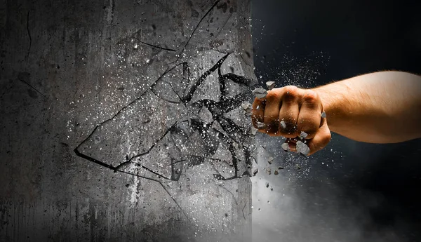 Hand breaking through the wall. Mixed media — Stock Photo, Image