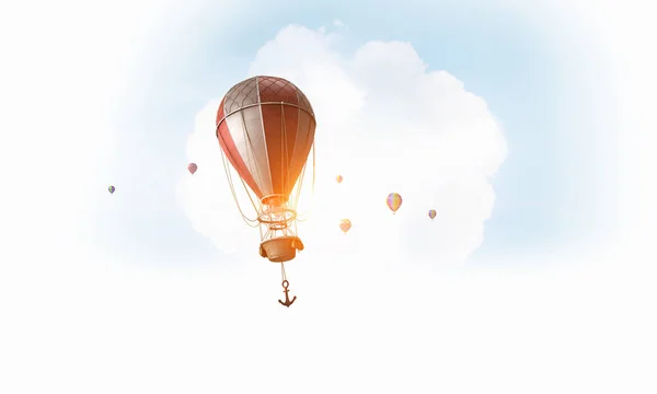 Air balloon in blue sky. Mixed media — Stock Photo, Image