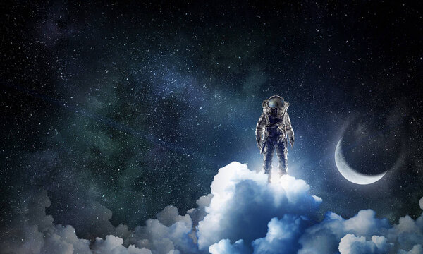 Spaceman in suit against dark starry sky. Mixed media