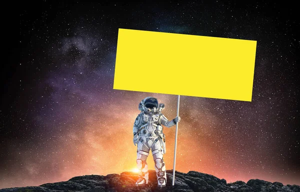 Spaceman met banner. Mixed media — Stockfoto