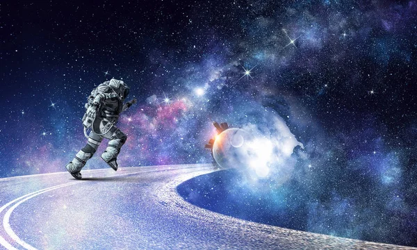 Running spaceman and galaxy. Mixed media — Stock Photo, Image