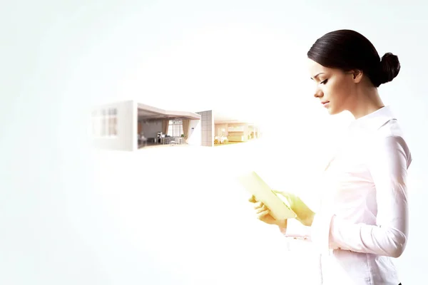 Woman using tablet device. Mixed media — Stock Photo, Image