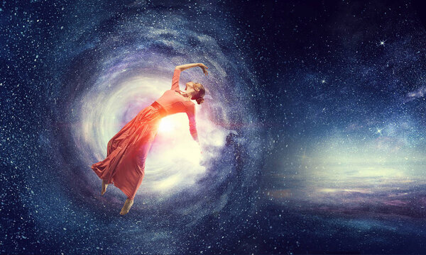 Young beautiful woman wearing red dress in space