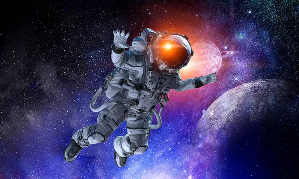 Astronaut on space mission. Mixed media — Stock Photo, Image