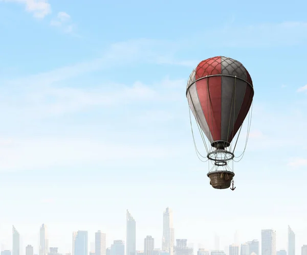 Air balloon in blue sky. Mixed media — Stock Photo, Image