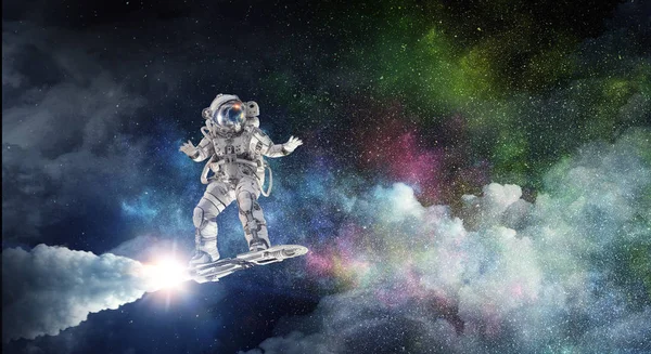 Spaceman on flying board. Mixed media — Stock Photo, Image