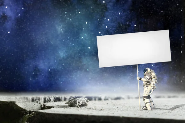 Spaceman met banner. Mixed media — Stockfoto