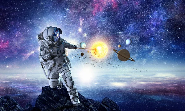 Spaceman steal planet. Mixed media — Stock Photo, Image