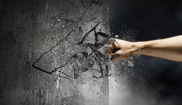 Hand breaking through the wall. Mixed media — Stock Photo, Image