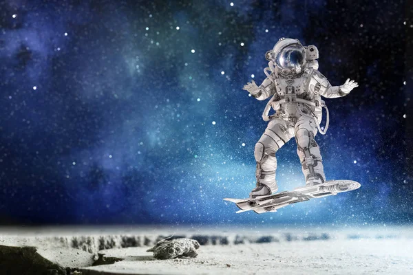 Spaceman on flying board. Mixed media — Stock Photo, Image