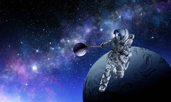 Spaceman stjäla planet. Mixed media — Stockfoto