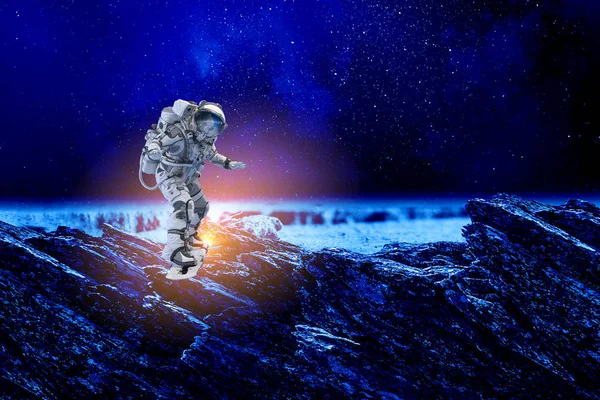 Spaceman on flying board. Mixed media — Stock Photo, Image