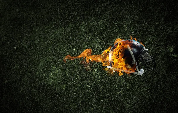 Hořící rugby helma — Stock fotografie
