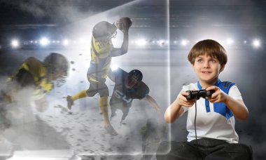 Bir video oyunu oynayan çocuk. Karışık teknik