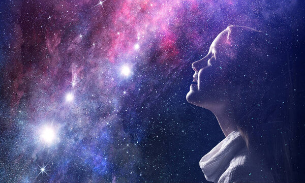 Profile of kid girl against space starry background