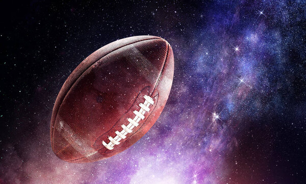 American football ball floating in open space