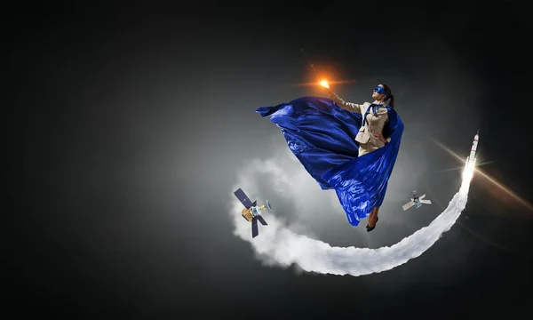 Super woman in sky. Mixed media — Stock Photo, Image