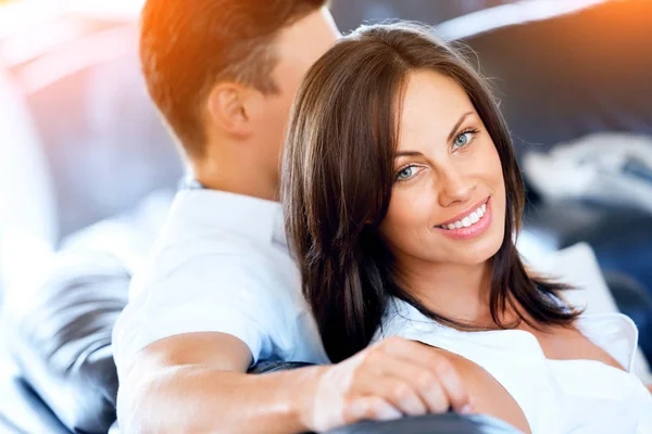 Young couple talking while sitting at home — Stock Photo, Image