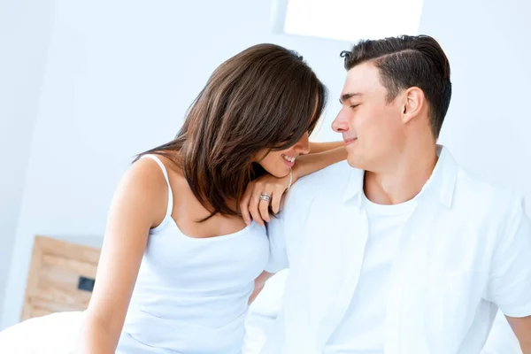 Young happy couple in the bedroom — Stock Photo, Image