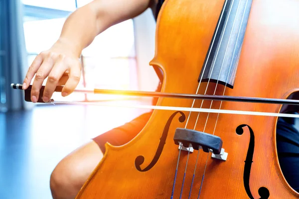 Close up of cello with bow in hands — Stock Photo, Image