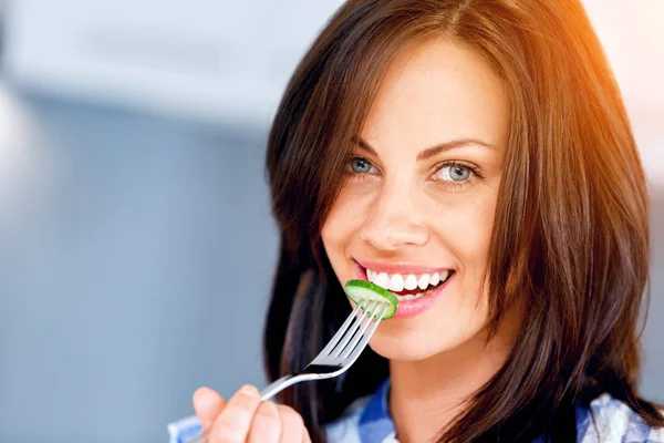 Young woman with a fork — Stock Photo, Image