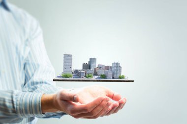 Avucunda sunulan mini dış şehir modeli. Karışık teknik