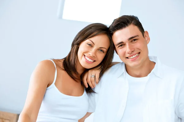 Young happy couple in the bedroom — Stock Photo, Image