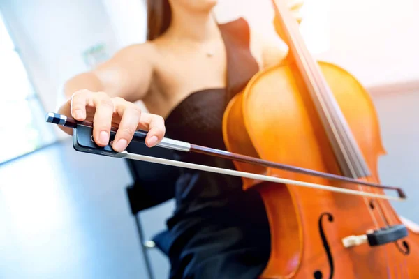 Close up of cello with bow in hands — Stock Photo, Image