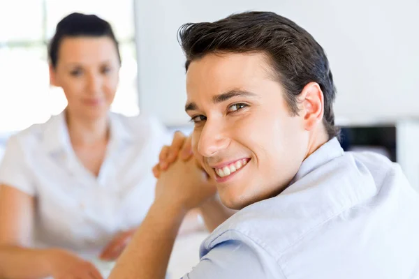 Young man in casual in office — Stock Photo, Image