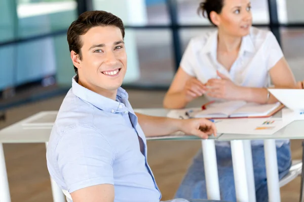 Young man in casual in office — Stock Photo, Image