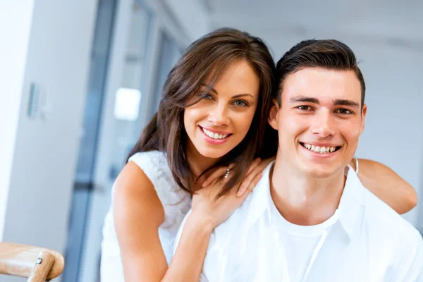 Smiling merry couple looking at camera — Stock Photo, Image