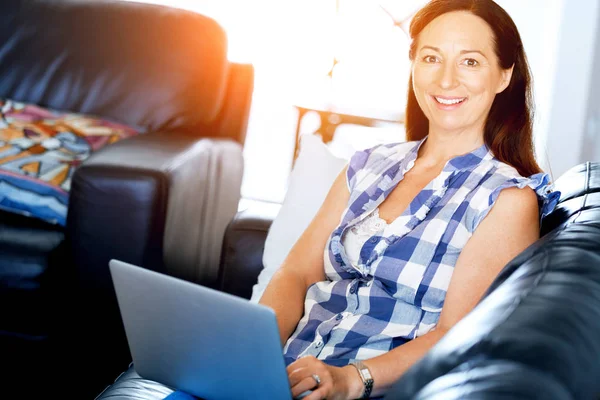 Mature beautiful woman working on her laptop — Stock Photo, Image