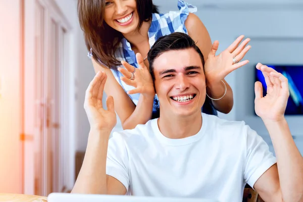 Smiling merry couple looking at camera — Stock Photo, Image