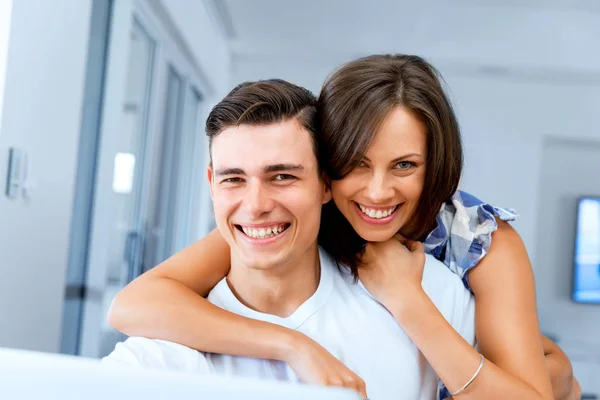 Smiling merry couple looking at camera — Stock Photo, Image