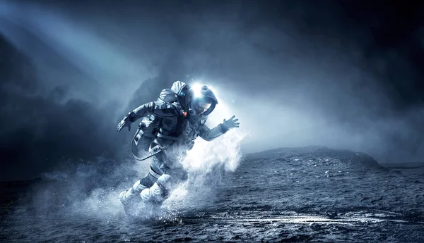 Spaceman igång snabbt. Mixed media — Stockfoto