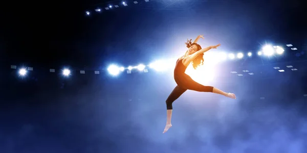 Gymnast girl in jump Смешанные медиа — стоковое фото