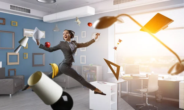 Dancing businesswoman in office. Mixed media — Stock Photo, Image