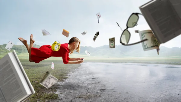Woman fly in air and use mobile. Mixed media — Stock Photo, Image