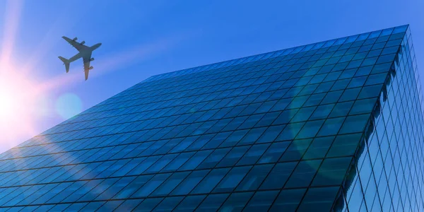 Airplane above business city — Stock Photo, Image