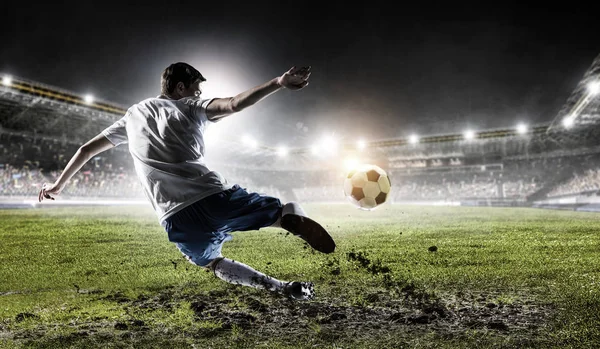 Soccer player at stadium. Mixed media — Stock Photo, Image