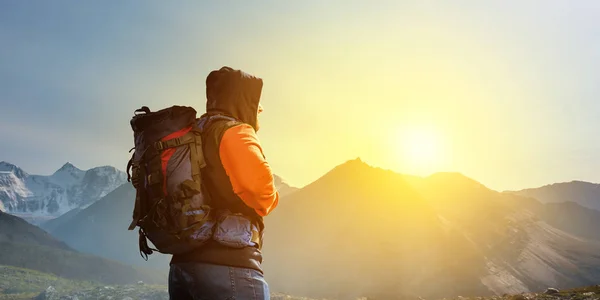 Hiker man in mountains. Mixed media — Stock Photo, Image