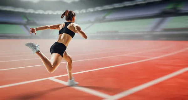 Sportswoman running race. Mixed media — Stock Photo, Image