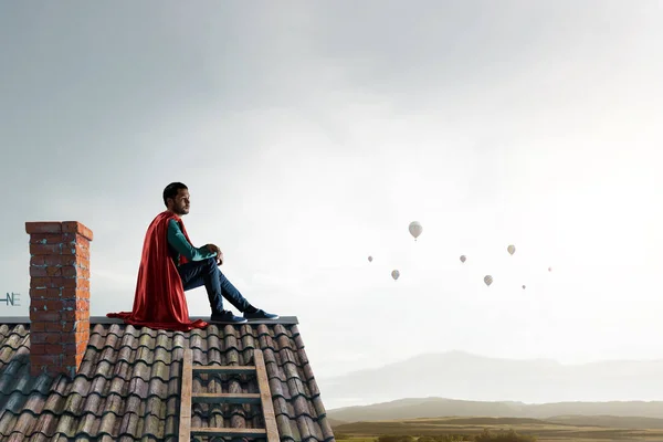 屋顶上的超级英雄。混合媒体 — 图库照片