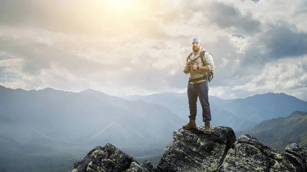 Hiker man in mountains. Mixed media — Stock Photo, Image