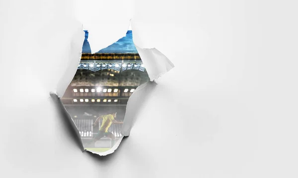 Papier-Riss-Loch-Effekt mit Stadionblick. Gemischte Medien — Stockfoto