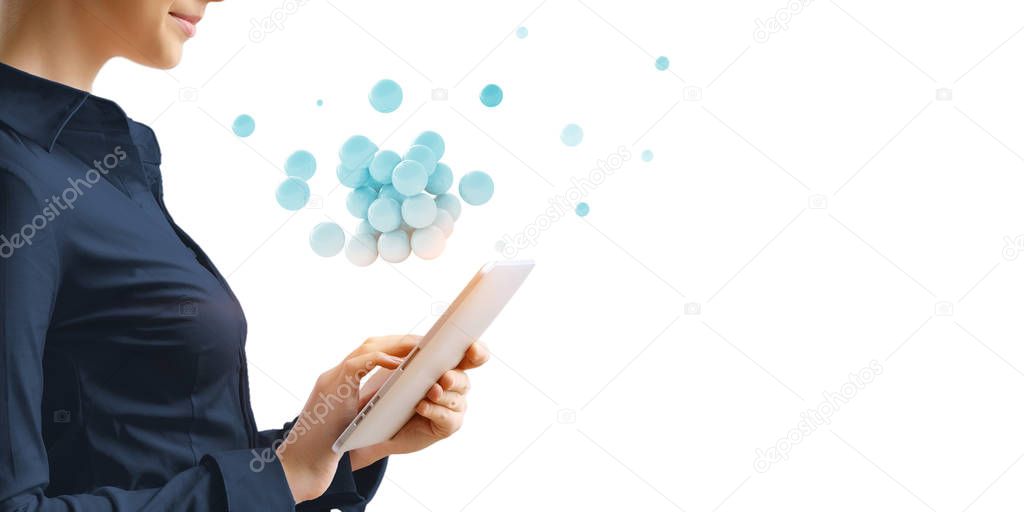 Businesswoman holding a tabalet with a bunch of spheres levitating above. Mixed media