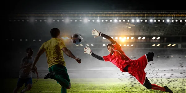 Soccer players on stadium in action. Mixed media — Stock Photo, Image